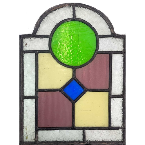 52 - A group of three Edwardian arched stained and leaded glass panels. 1: Each 31X23cm, together with a ... 