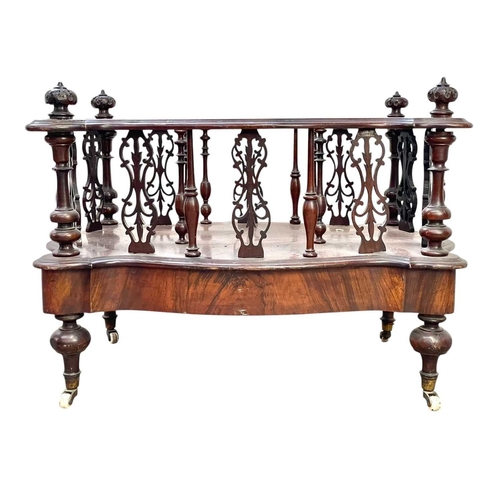 520 - A Victorian walnut serpentine Canterbury or magazine rack. With scroll inlaid top, turned and pierce... 