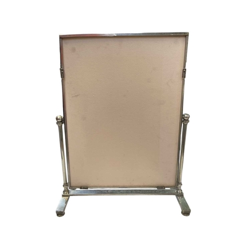 55 - A silver plated rectangular picture frame. On an easel stand, with a decorative border and a bevelle... 