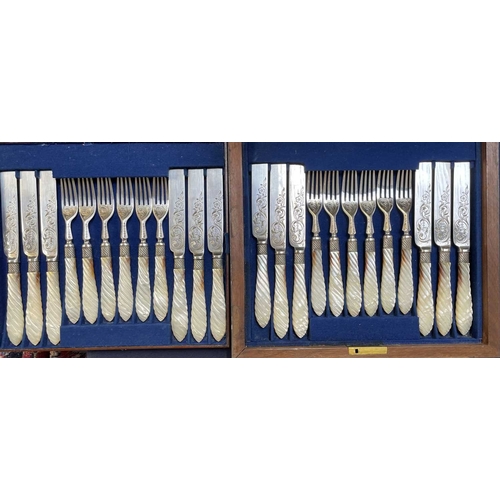 63 - A cased Victorian mother of pearl dessert set. Twelve knives and forks, with scroll and foliage deco... 