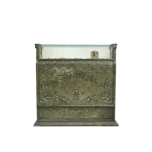 69 - A late 19th century American National cash register. In an ornate cast brass case, with applied labe... 