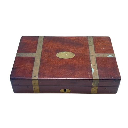 77 - A brass bound mahogany surgeon's box. Early 19th century, containing a few scalpels, knives, and mis... 