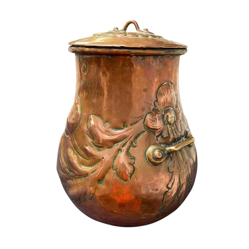 82 - An early 19th century continental copper pot and cover. Of bellied form, with repousse floral and fo... 