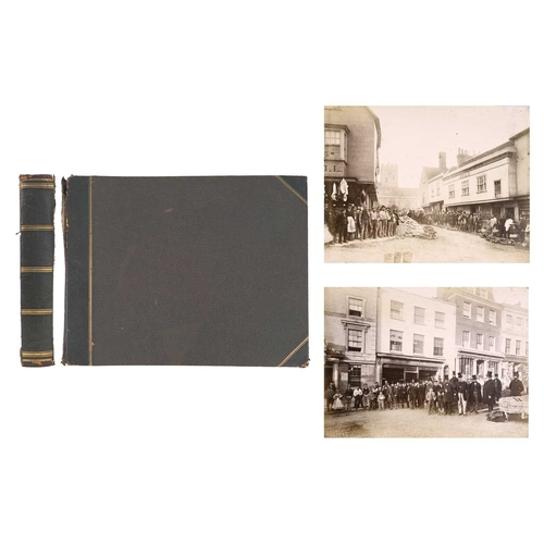 355 - A late 19th early 20th century photograph album Including twelve sepia photographs depicting landmar... 