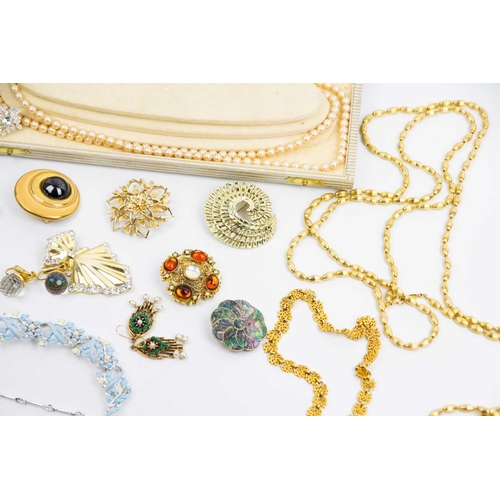 287 - A large selection of gold-tone costume jewellery. Some paste set, and other costume jewellery.