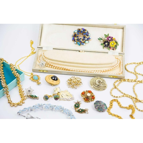 287 - A large selection of gold-tone costume jewellery. Some paste set, and other costume jewellery.