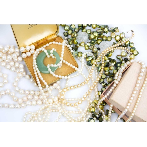 289 - A selection of cultured pearl necklaces. To include a celadon green jadeite and white pearl double s... 