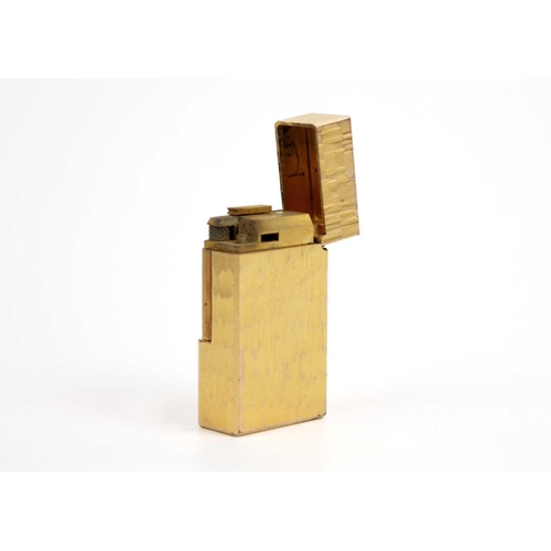 295 - A Flaminaire gold-plated lighter. The lid interior stamped TPU29 VINCI, length 52mm.