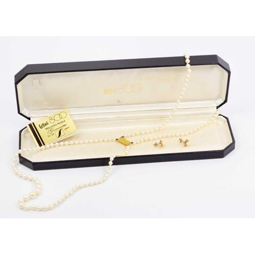 299 - A Lotus double-strand simulated pearl necklace with 9k hallmarked clasp. Within original box, length... 