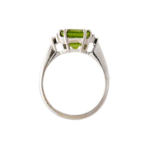 100 - A square emerald-cut peridot and diamond 18k white gold ring. The vivid green peridot is 7mm x 7mm a... 