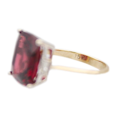 103 - A Rhodolite garnet and diamond 18k gold dress ring. The square cushion-cut purplish red garnet is 12... 