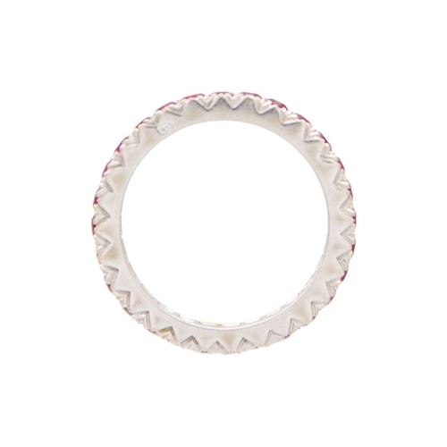 106 - A French full eternity ruby band ring in 18k white gold. The round mixed-cut rubies are 2mm approx.,... 