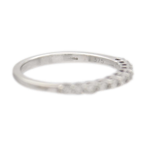 114 - A 9k white gold half-eternity diamond ring. White brilliant-cut diamonds are 1.5mm approx., hallmark... 