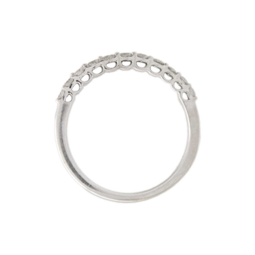 114 - A 9k white gold half-eternity diamond ring. White brilliant-cut diamonds are 1.5mm approx., hallmark... 