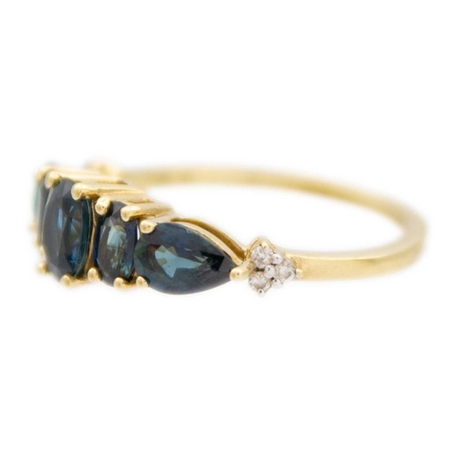 118 - A 9k gold Australian teal sapphire and diamond ring. The sapphires of an oval and pear shape mixed-c... 