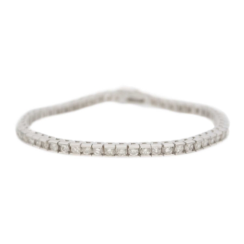 122 - A 14k white gold brilliant-cut diamond line bracelet. Tested 14k, diamonds' total weight 4.85 ct, si... 