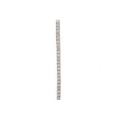 122 - A 14k white gold brilliant-cut diamond line bracelet. Tested 14k, diamonds' total weight 4.85 ct, si... 