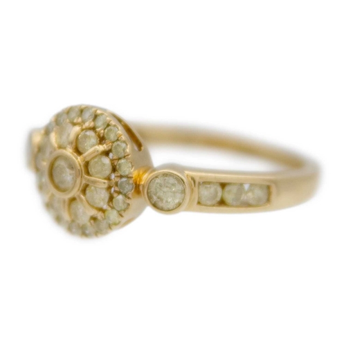 128 - A 9k gold yellow diamond cluster ring. The largest three diamonds are 2.5mm approx., the head is 9mm... 