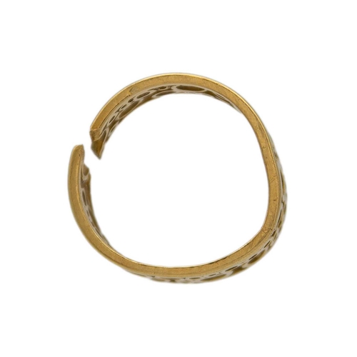 138 - An 18k openwork band ring by Tiffany & Co. The band formed with various sized open circles, hallmark... 