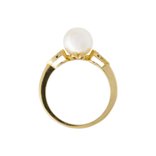 177 - A 9k cultured pearl and diamond set ring. The shoulders pave set with small diamonds, size N, 2.8g.