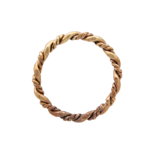 89 - A 9k gold twisted design bangle with two twist stacking rings. The bangle is 6.5cm in diameter, fanc... 