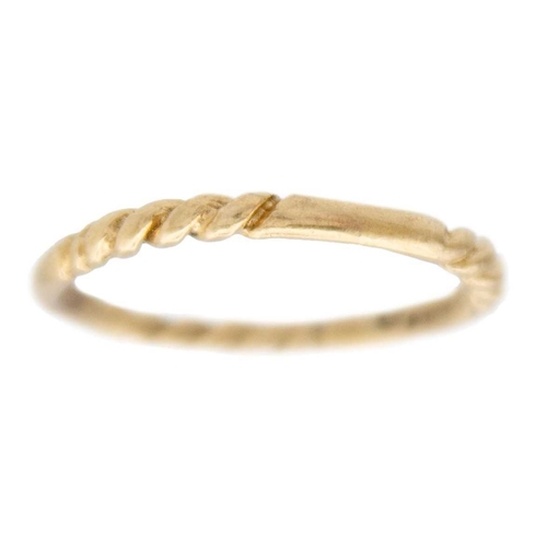 89 - A 9k gold twisted design bangle with two twist stacking rings. The bangle is 6.5cm in diameter, fanc... 