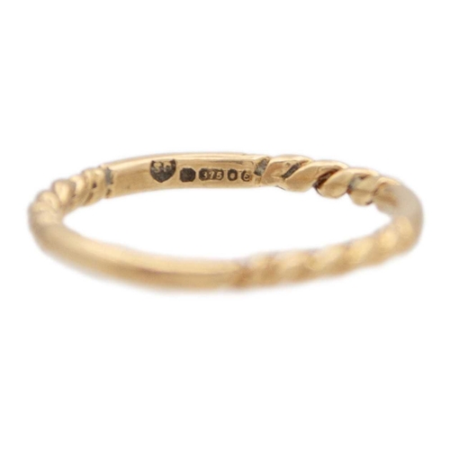 89 - A 9k gold twisted design bangle with two twist stacking rings. The bangle is 6.5cm in diameter, fanc... 