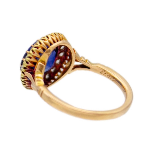 95 - An 18k rose gold synthetic blue sapphire and diamond set halo ring. The stone is approx 4.5ct (1cm i... 