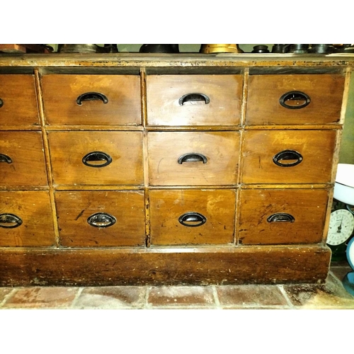 112 - ± Clemence's Ironmongers Nest of drawers A nest of 15 shop storage drawers HxWxD 78x161x25cm