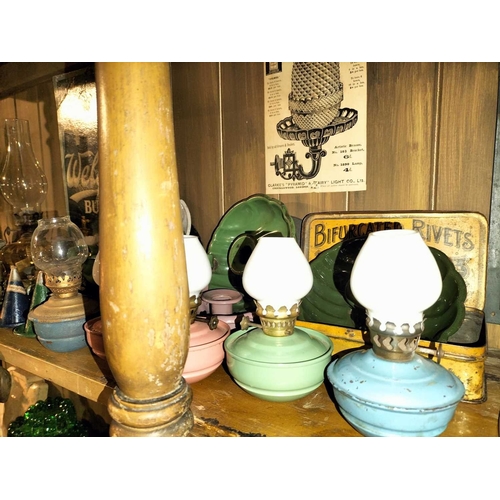 119 - ± Clemence's Ironmongers A collection of oil lamp burners and parts A large collection of oil lamp p... 