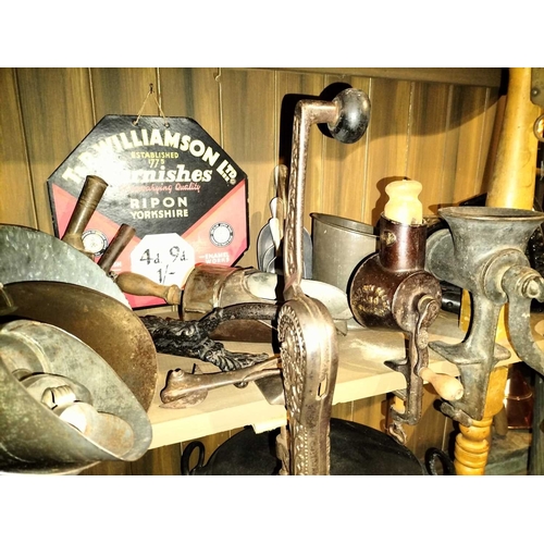 124 - ± Clemence's Ironmongers Mixed kitchen iron wares A part shelf of mixed iron wares to include 