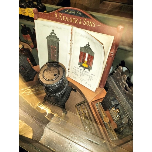 154 - ± Clemence's Ironmongers A Kenrick and sons a shop window display incorporating miniature stoves and... 