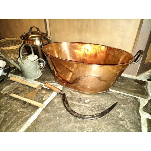 156 - ± Clemence's Ironmongers Copper wash bowl, tools ,copper covered pail ,watering can etc A good and l... 