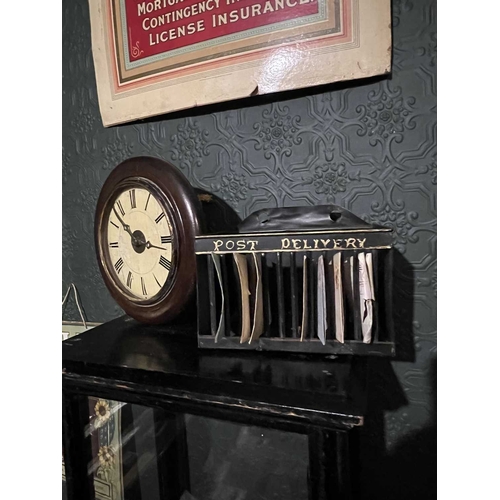 17 - ± The Advocate's Office A Barristers Wig, a clock and a letter rack The light grey wig in a glazed c... 