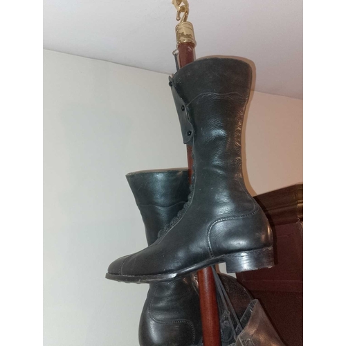 177 - ± Public Benefit Boot Company Six pairs of Victorian and later boots Hanging from a display wood and... 