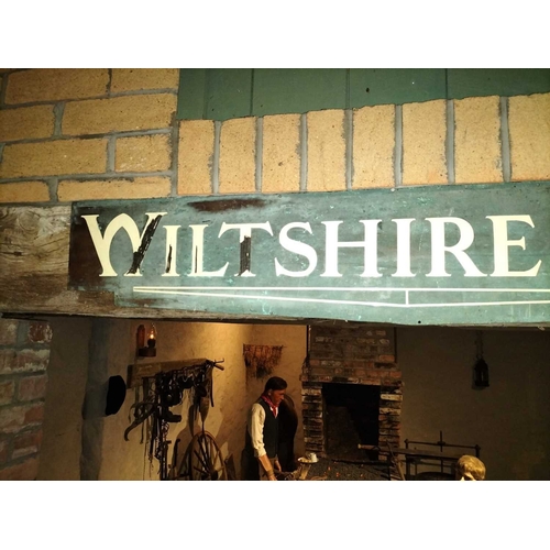 205 - ± Wiltshire & Son Blacksmiths Brass and enamel shop signs A pair of shaped brass and enamel signs wi... 