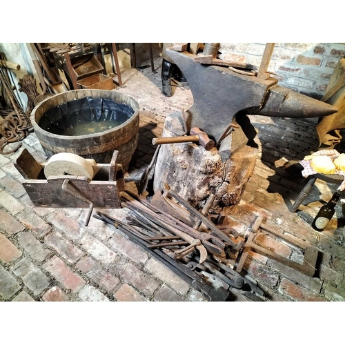 211 - ± Wiltshire & Son Blacksmiths Forge tools and anvil A large anvil with various attachment tools toge... 