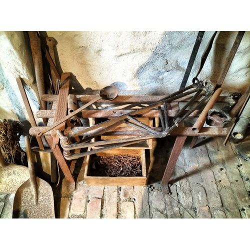 212 - ± Wiltshire & Son Blacksmiths ironwork A collection of ironwork including a bench, tools,horse shoes... 