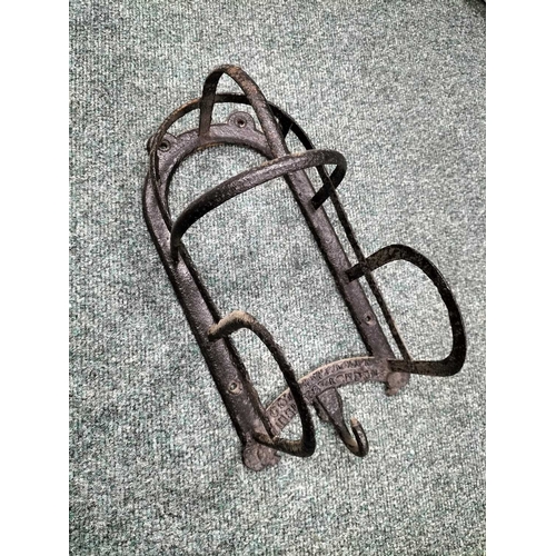 213 - ± Wiltshire & Son Blacksmiths Leather horse tack etc An iron bridle rack by Cottam and Co of Winsley... 