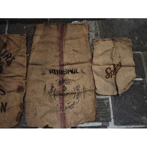 214 - ± Wiltshire & Son Blacksmiths Sacks A collection of eighteen hessian sacks and one cotton sack front... 