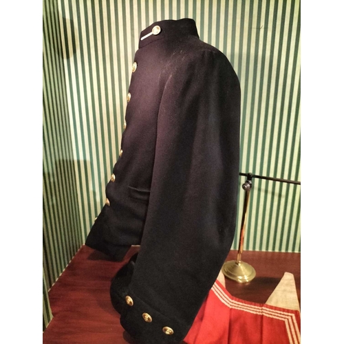 242 - ± Lewis & Bull Military Tailors Militaria A Midshipman's jacket on a brass and ceramic torso stand t... 