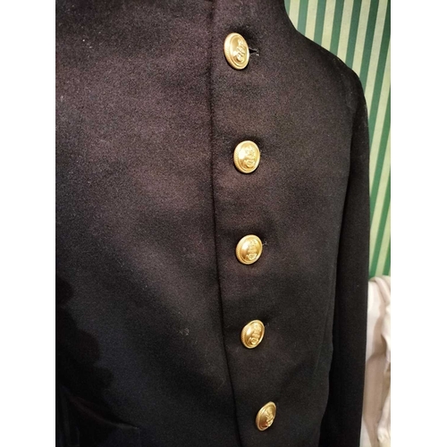 242 - ± Lewis & Bull Military Tailors Militaria A Midshipman's jacket on a brass and ceramic torso stand t... 