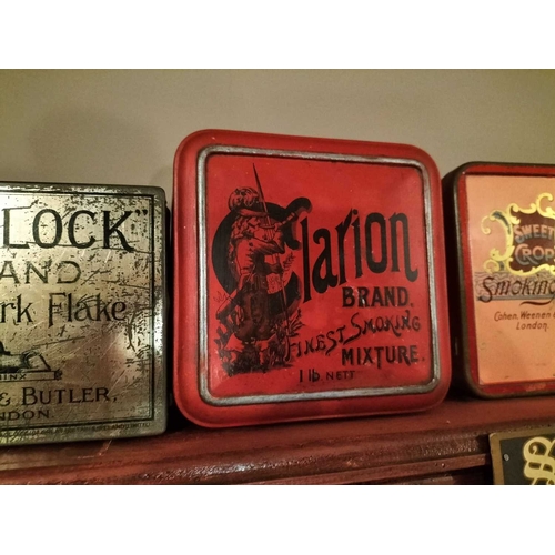 272 - ± M King Tobacconist Collection of tobacco and cigarette tins A shelf load of cigarette tins includi... 