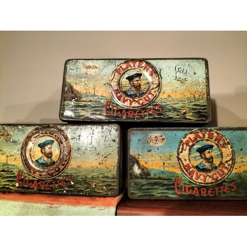 272 - ± M King Tobacconist Collection of tobacco and cigarette tins A shelf load of cigarette tins includi... 