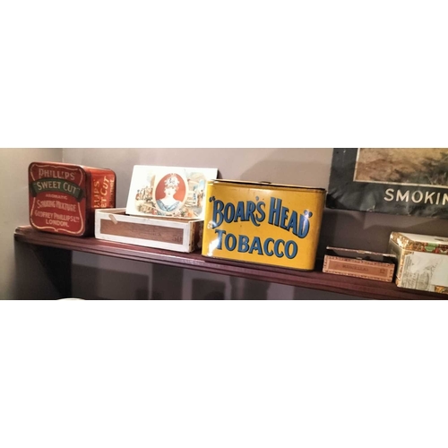 273 - ± M King Tobacconist Collection of tobacco tins and packaging A shelf of tins including Boars Head,P... 