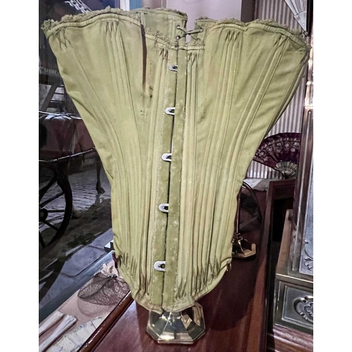 294 - ± Corsetiere Miss Penrose Corsets Six corsets on brass stands