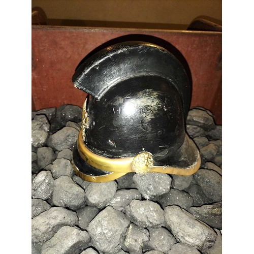 308 - ± Flambards Fire Station Six items from the Fire Station A leather and brass fireman's helmet, a lea... 