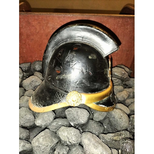 308 - ± Flambards Fire Station Six items from the Fire Station A leather and brass fireman's helmet, a lea... 