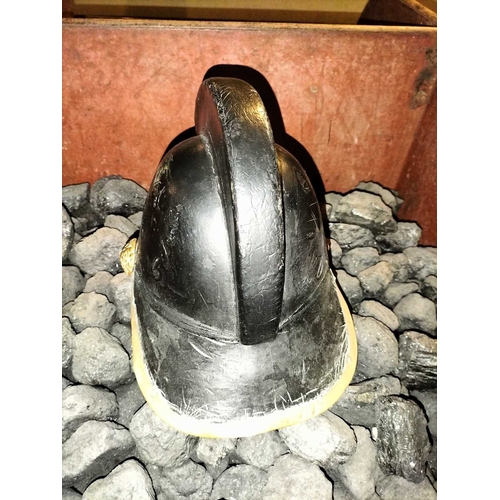 308 - ± Flambards Fire Station Six items from the Fire Station A leather and brass fireman's helmet, a lea... 