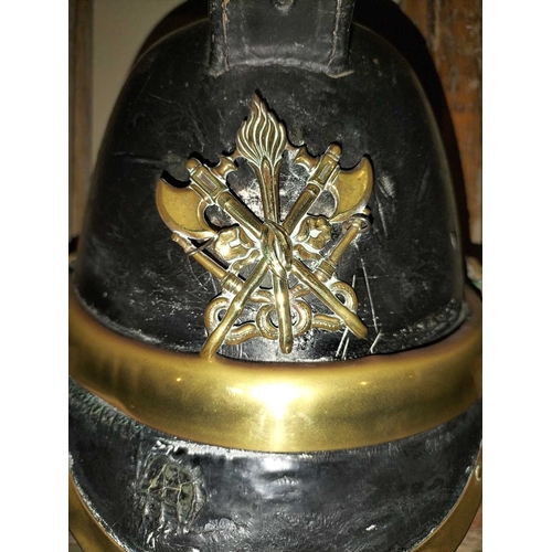 308 - ± Flambards Fire Station Six items from the Fire Station A leather and brass fireman's helmet, a lea... 